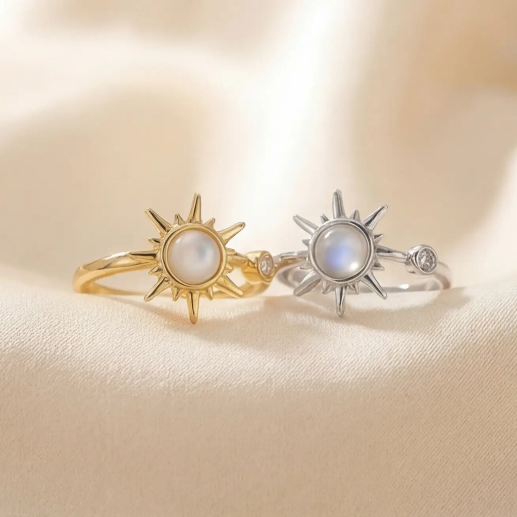 Gold and silver moonstone sunburst calm rings front view on neutral background