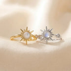 Gold and silver moonstone sunburst calm rings front view on neutral background