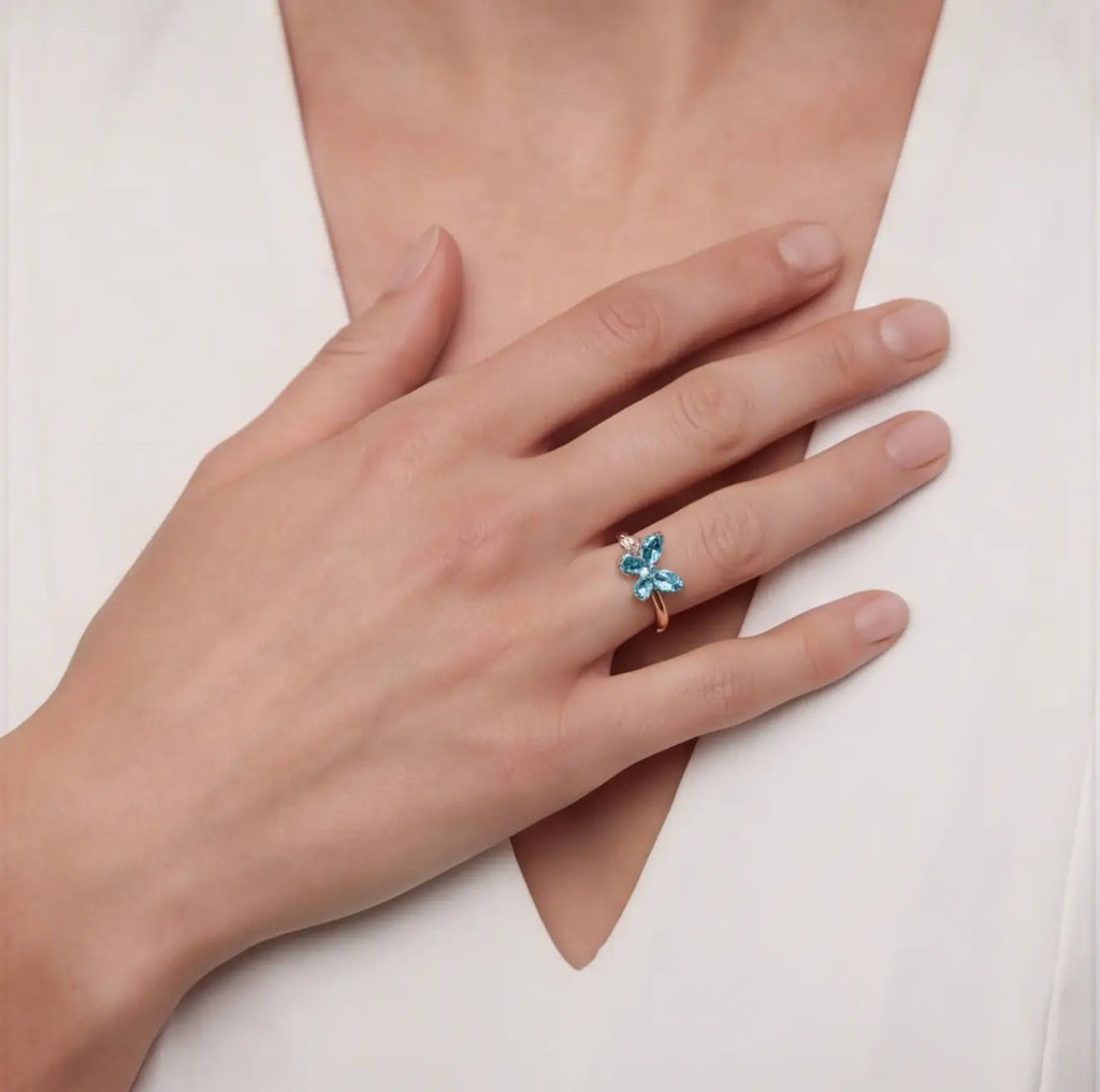 Blue Agio butterfly calm ring worn on hand as a grounding jewelry piece