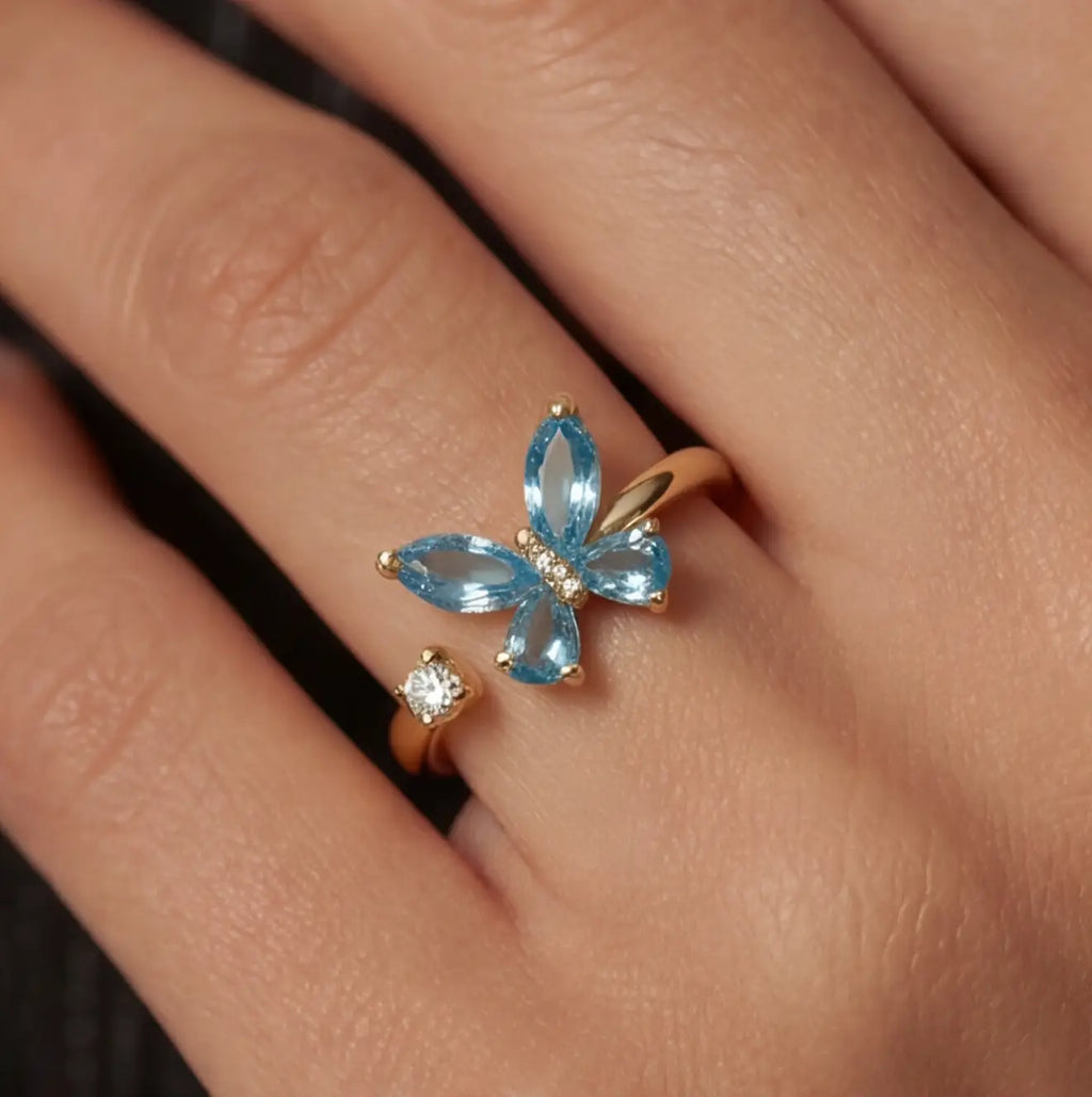 Close up of blue Agio butterfly fidget ring for stress