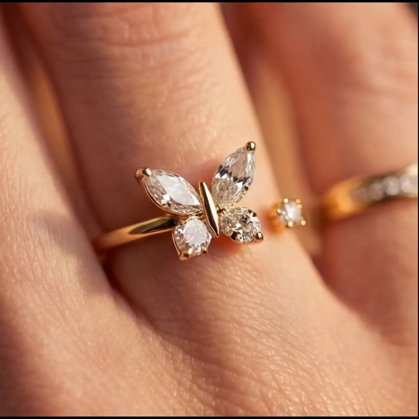 Close up of Agio gold butterfly fidget ring for calming