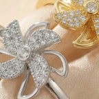 Macro close up of Lunela Attimo silver pavé pinwheel calm spinner ring with round center stone