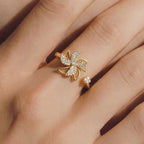 Model wearing Lunela Attimo silver pavé pinwheel calm spinner ring on hand