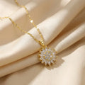 Lunela Collana gold flower pendant necklace worn on champagne satin background