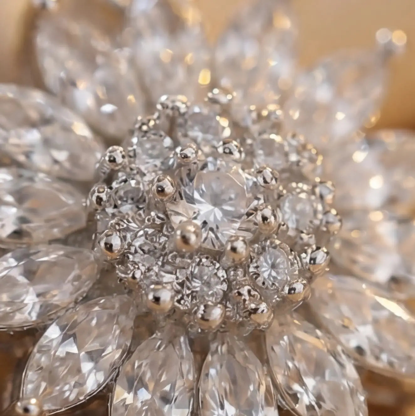 Macro close up of Lunela Collana silver flower pendant necklace featuring round brilliant crystal cluster center and marquise petal stones
