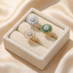 Lunela Fiorire sunflower calm rings in gold and silver displayed inside beige jewelry box