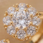 Silver flower cluster open calm ring with clear stones on silk background