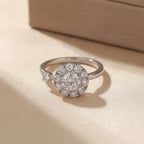 Macro close-up of gold flower cluster open calm ring with clear stones