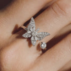 Raggio silver butterfly calm ring adjustable open band with pavé crystals worn on hand close up